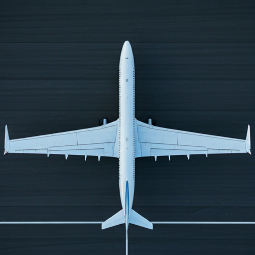 Top down view of aircraft wings on tarmac